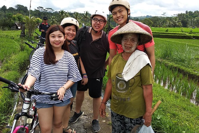 Ubud Cycling Tour - Riding through rice fields, temples, and village roads